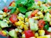 Vegetarian salad with corn and pineapples From fresh cucumbers