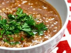 Recipes for aromatic lean soup kharcho with rice, tomatoes, adjika, basil, nuts